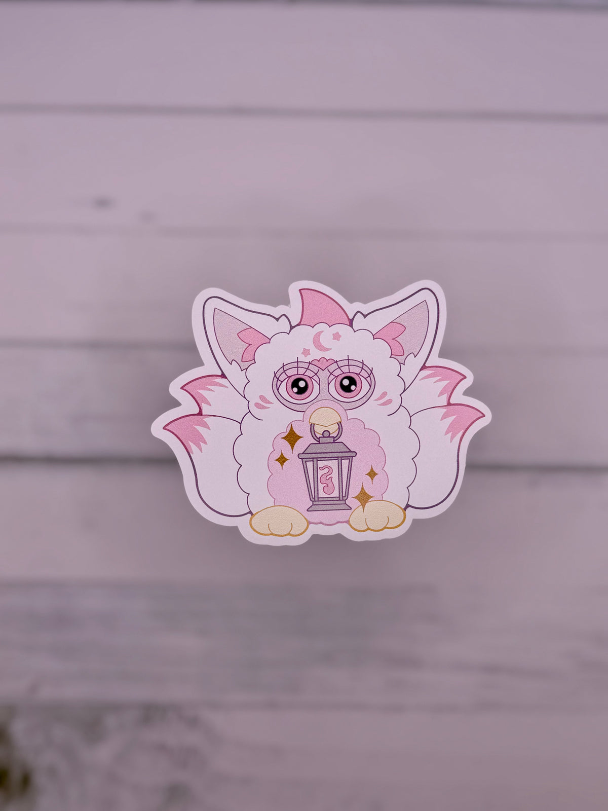 White and Pink retro electronic pet inspired fox spirit sticker holding a lantern with celestial details and fluffy tails