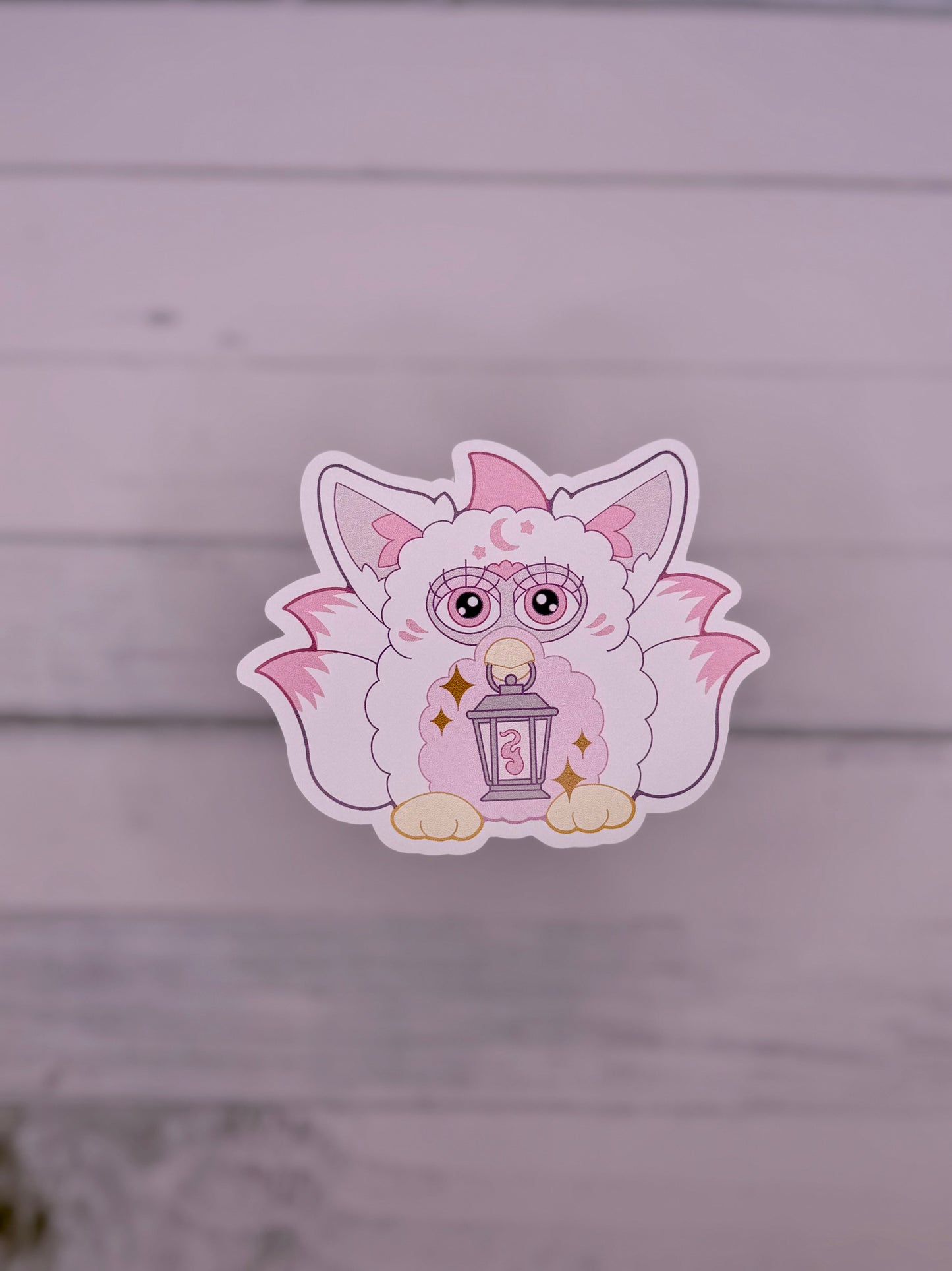 White and Pink retro electronic pet inspired fox spirit sticker holding a lantern with celestial details and fluffy tails