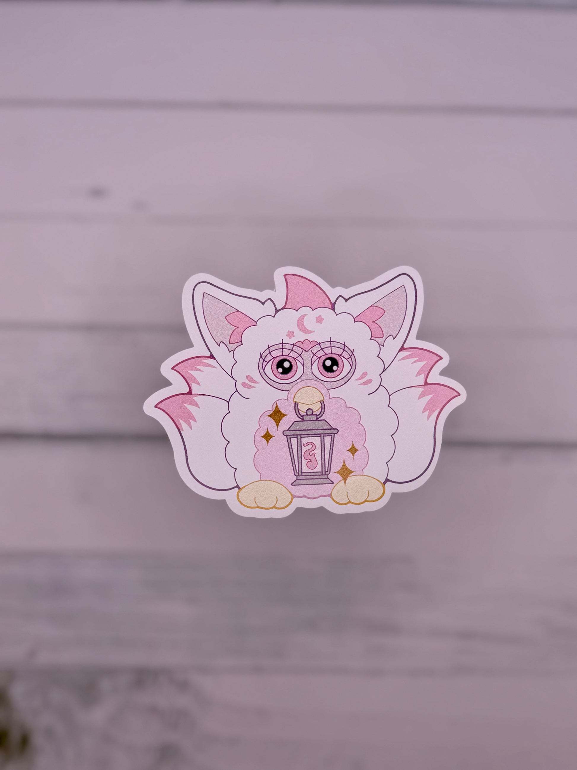 White and Pink retro electronic pet inspired fox spirit sticker holding a lantern with celestial details and fluffy tails